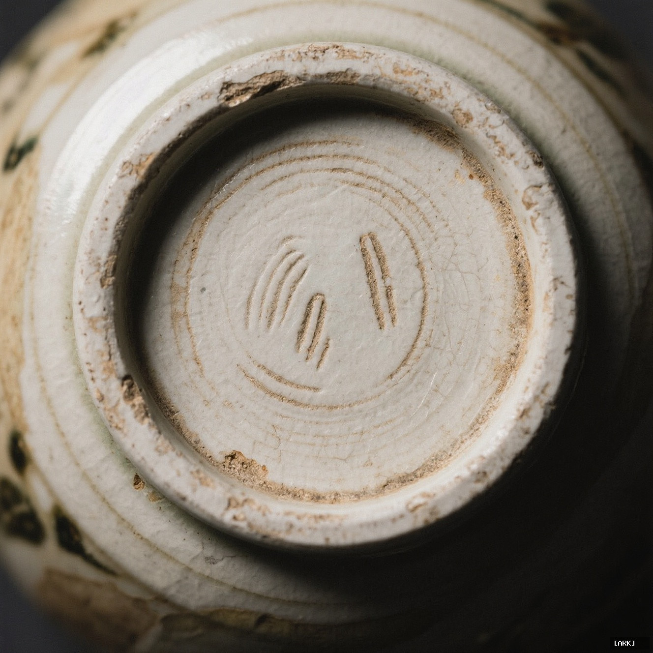 Close-up detail of a worn Joseon dynasty Korean buncheong ceramic bowl with…, featuring Asian art history