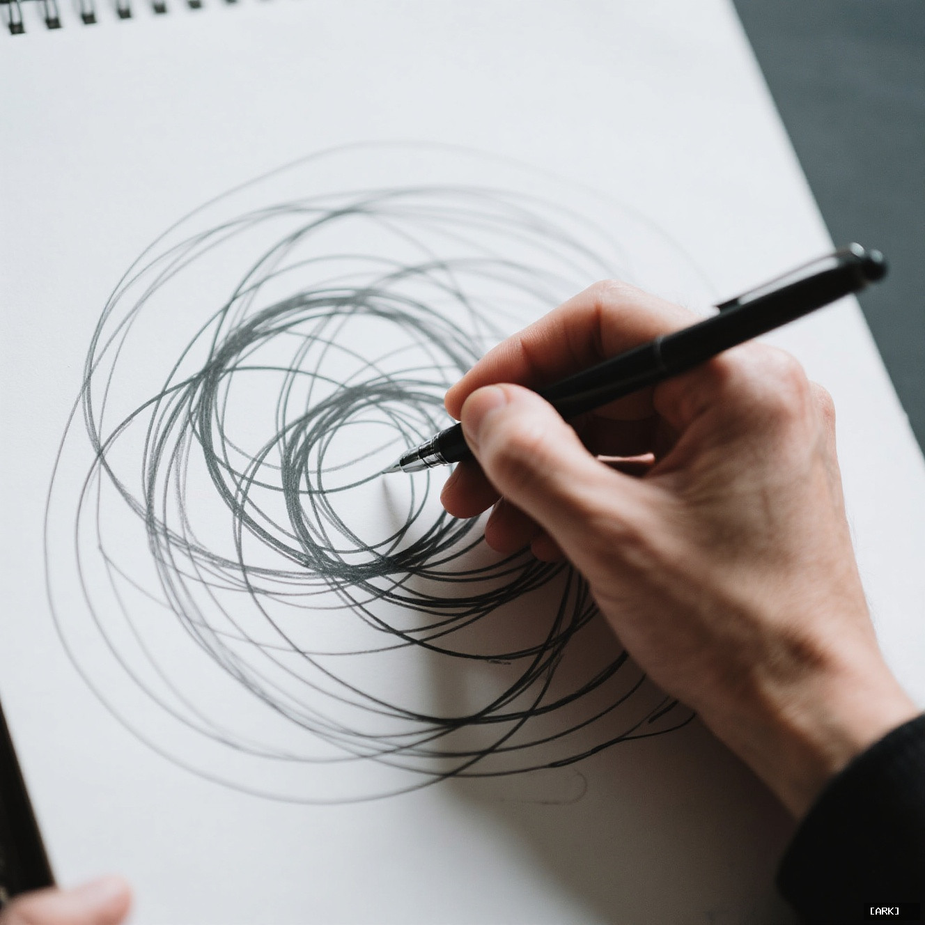close-up of a person's hand scribbling chaotic overlapping circles with a pen&hellip;, featuring fast way to reduce stress